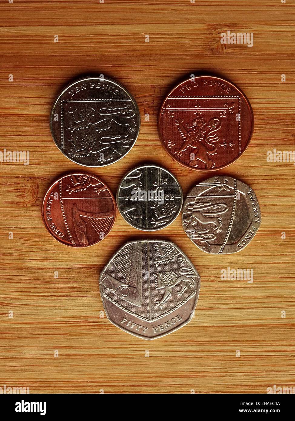 The coins of the United Kingdom arranged together to form the Royal coat of arms Stock Photo