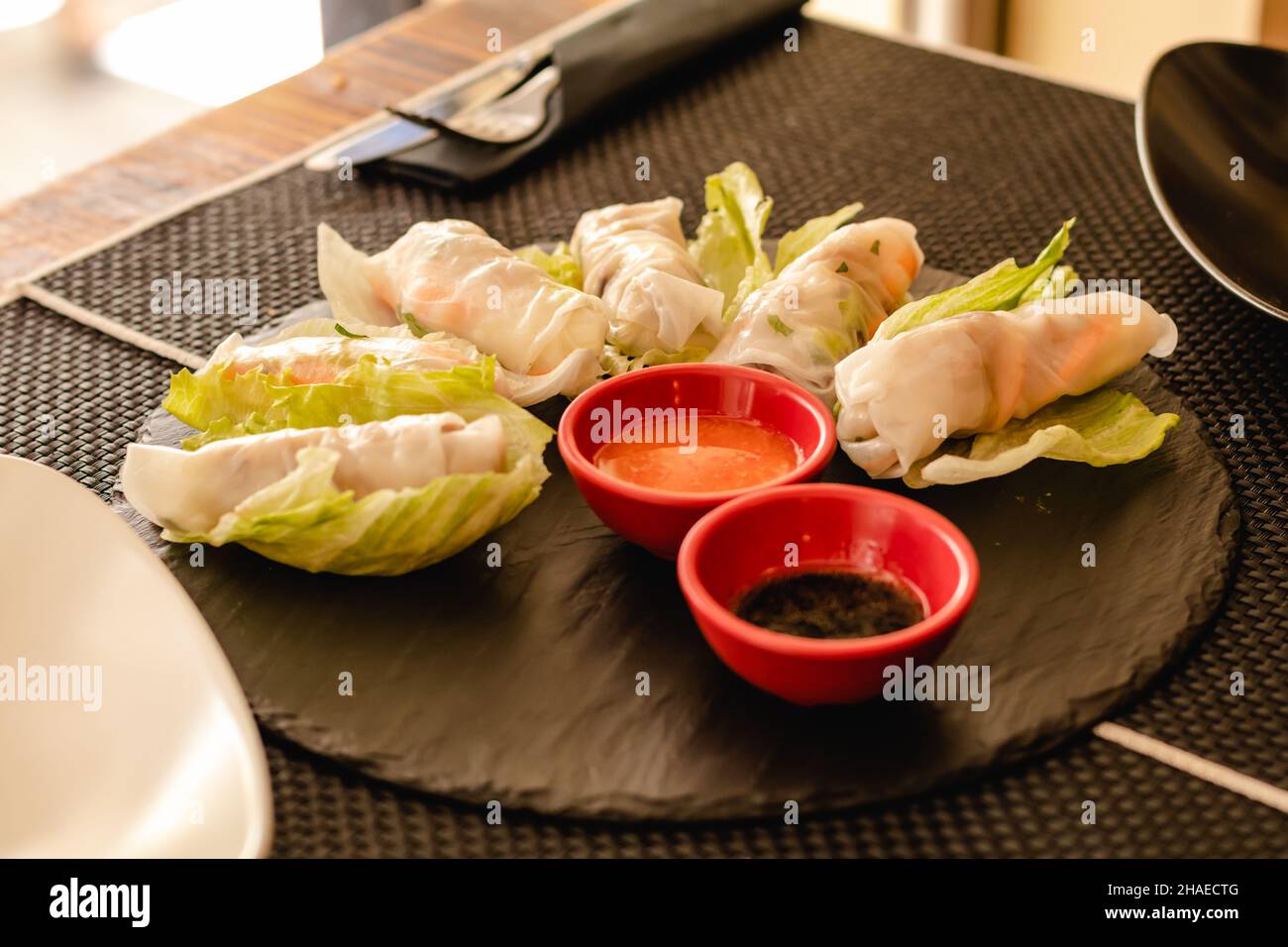 Vietnamese rolls with vegetables, served on restaurant Stock Photo