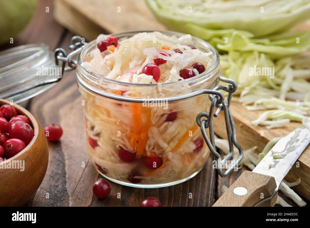 Jar of sour cabbage, pickled sauerkraut.  Fermented cabbage  with cranberries, coleslaw salad. Healthy food, diet food. Stock Photo