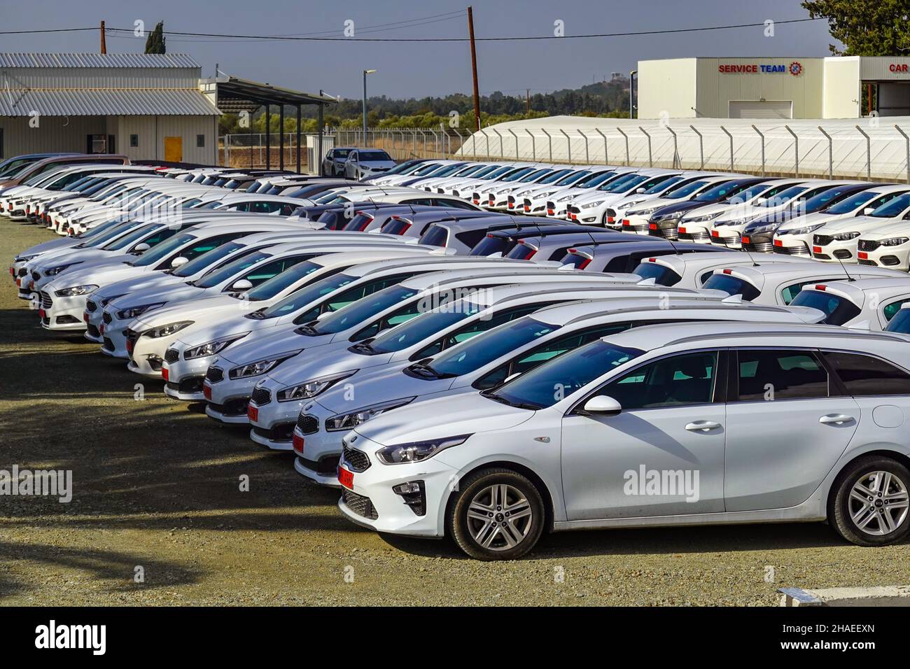 White hire cars parked near Paphos airport, Pafos, Cyprus, Mediterranean, holiday destination Stock Photo