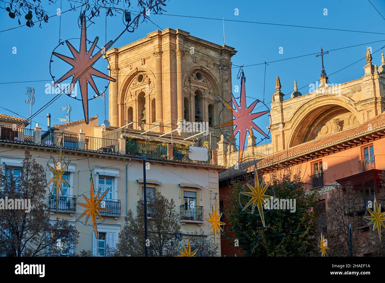 A walk in Granada: Plaza Bibrambla decorated with Christmas lighting with the cathedral in the background on a winter sunset Stock Photo