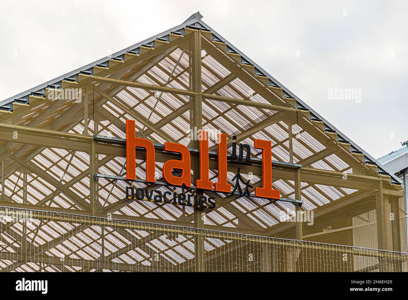 'Hall in one' is the name of the new shopping center and leisure area in Saint-Chamond, France. It was built in 2018 in the halls of the former local steel industry (Compagnie des forges et aciéries de la Marine et d'Homécourt). In the former industrial complex is the shopping mall 'Hall in 1' with cinema, brasseries, leisure and shopping facilities. Stock Photo