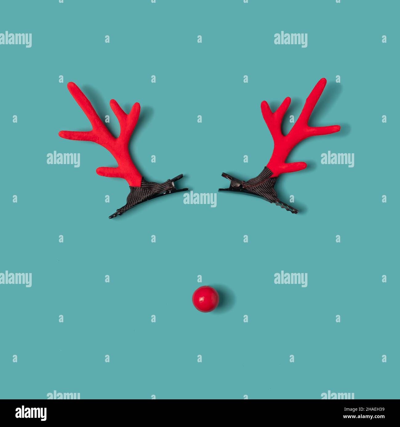 Reindeer shaped ornament layout on a pastel blue background. Winter holidays minimal concept Stock Photo