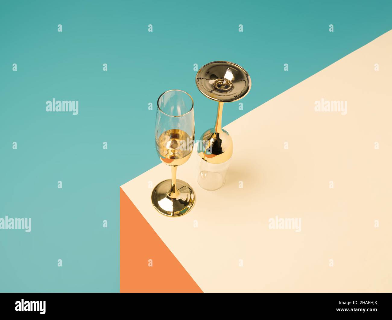 Champagne glasses on a geometric colorful pastel background. New Year party minimal concept Stock Photo