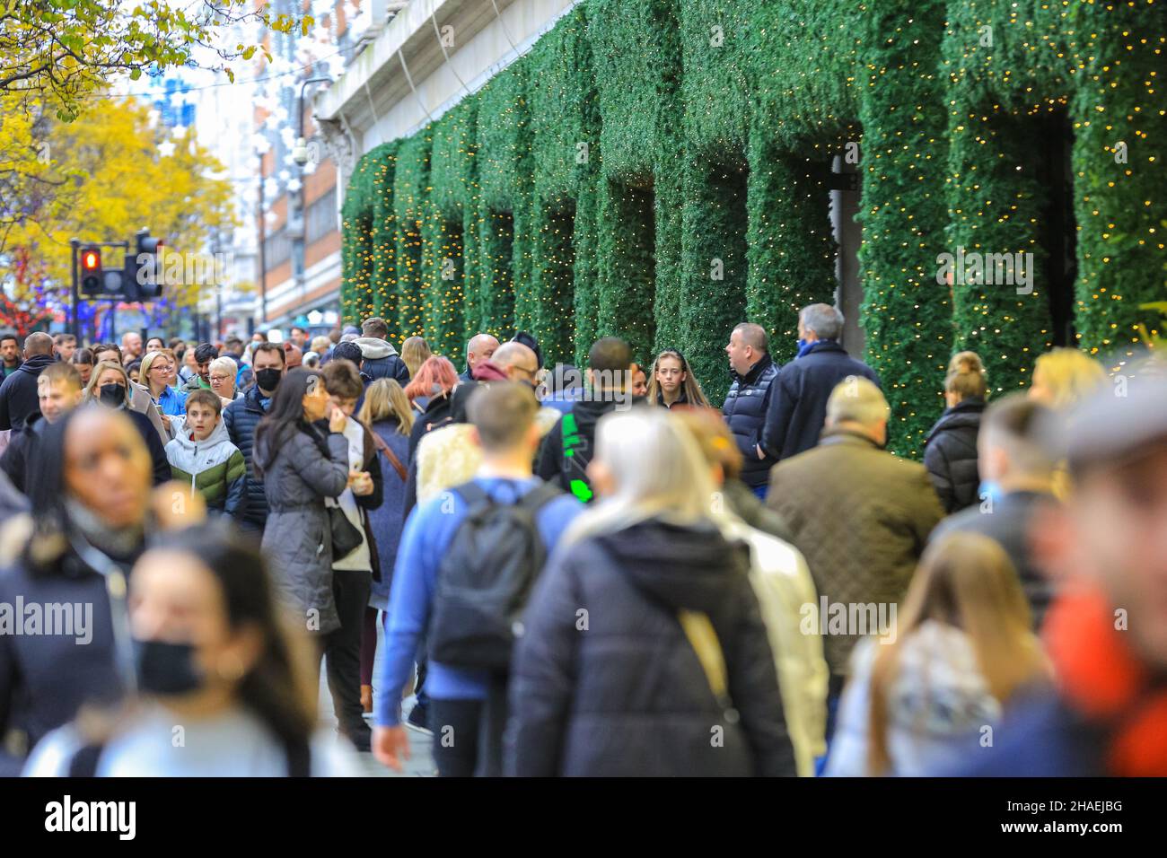 Oxford Street London, UK, 12th Dec 2021. View of the West End crowds. Shoppers and visitors to London crowd into busy Oxford Street today despite infection rates with the new omnicron covid variant in London, and the wider country, rising fast, and government considering the introduction of further measures to curb the trend. Stock Photo