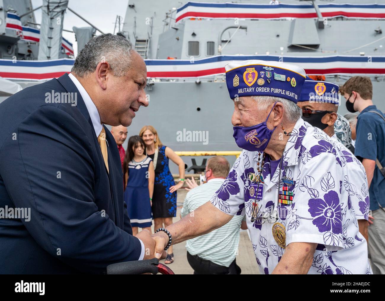 Pearl Harbor, United States. 08 December, 2021. U.S. Secretary of the Navy Carlos Del Toro, greets meets with Purple Heart recipients following the commissioning ceremony for the newest guided-missile destroyer, USS Daniel Inouye at Joint Base Pearl Harbor-Hickam, December 8, 2021 in Honolulu, Hawaii. The warship honors former U.S. Senator and Medal of Honor recipient Daniel Inouye. Credit: MC2 Logan Keown/U.S. Navy/Alamy Live News Stock Photo