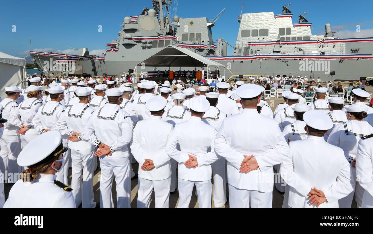 Pearl Harbor, United States. 08 December, 2021. U.S. Navy sailors listen to Ken Inouye, son of former Senator Daniel Inouye, during the commissioning ceremony for the newest guided-missile destroyer, USS Daniel Inouye at Joint Base Pearl Harbor-Hickam, December 8, 2021 in Honolulu, Hawaii. The warship honors former U.S. Senator and Medal of Honor recipient Daniel Inouye. Credit: MC1 Sean P. La Marr/U.S. Navy/Alamy Live News Stock Photo