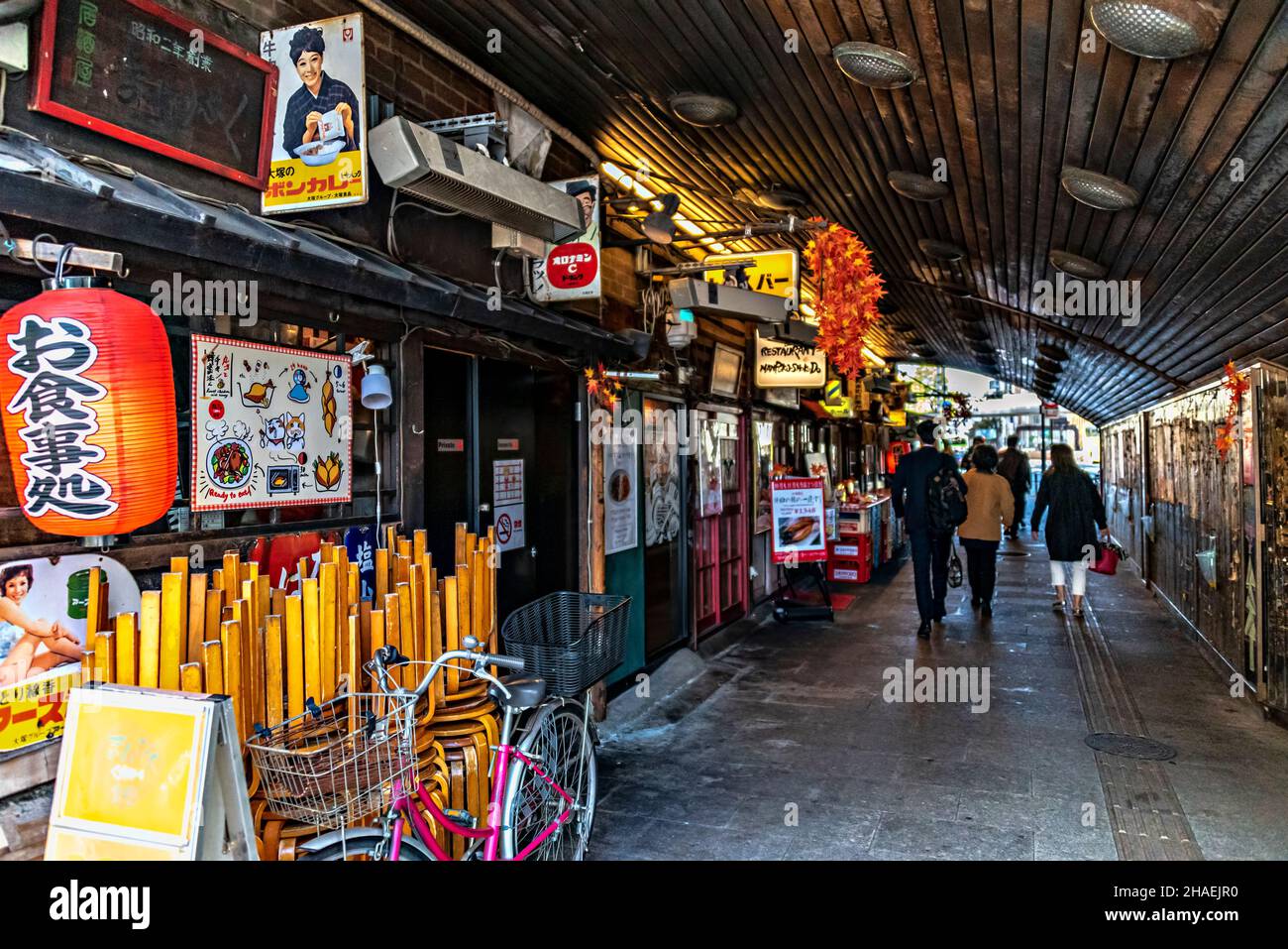 Izakayas, food & drink taverns under the subway tracks in Yurakucho, Tokyo, Japan. Stock Photo