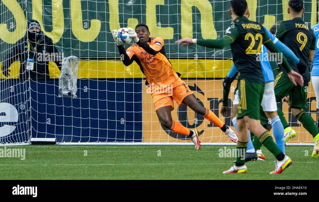 New York's goalie Sean Johnson saves a shot by the Timbers in the early