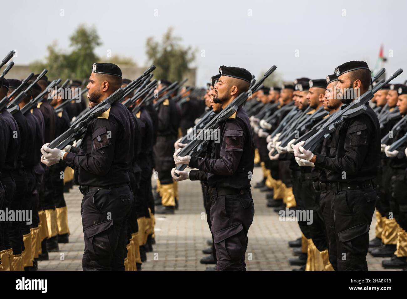 Gaza, Palestine. 12th Dec, 2021. Members of the Palestinian security forces loyal to Hamas, stand during a graduation ceremony for police officers, in Gaza City.Hamas arranges a graduation ceremony for police officers to show their military skills to the public. Hamas Intensifying military courses for its police forces to avoid Israeli threats that may threaten internal security in the Gaza Strip, according to the Hamas Interior Ministry spokesman. (Photo by Ahmed Zakot/SOPA Images/Sipa USA) Credit: Sipa USA/Alamy Live News Stock Photo