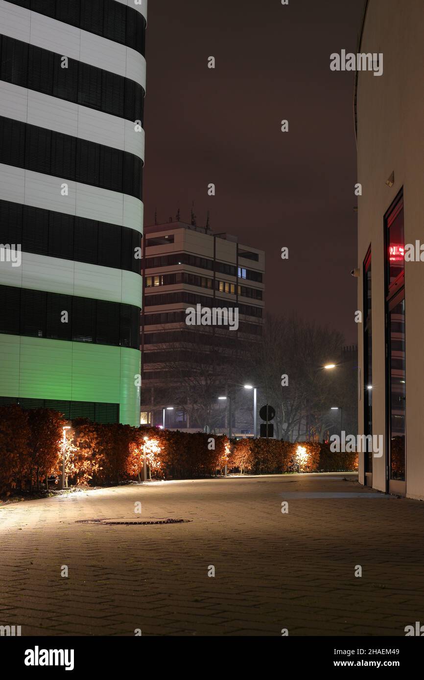 scenic view of a pathway between buildings at night Stock Photo
