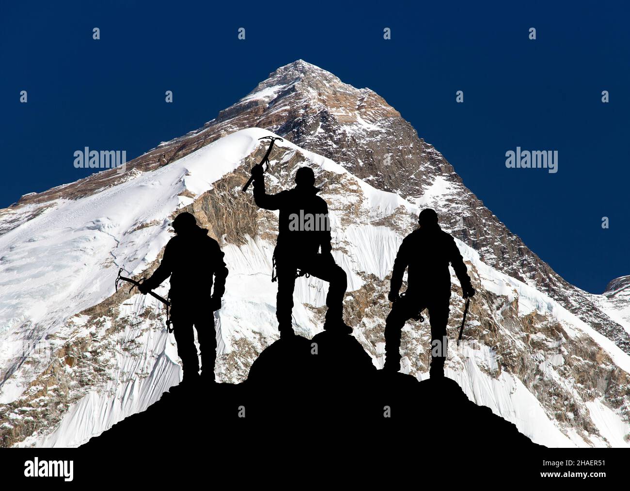 Mount Everest, from Pumo Ri base camp and silhouette of three climbing