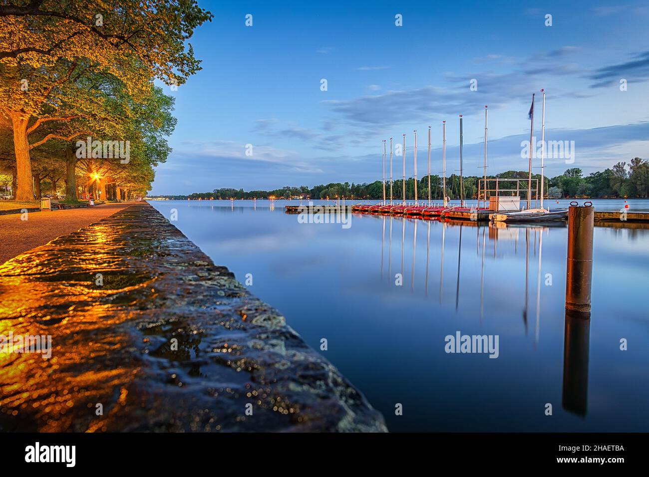 A scenic view of a calm Masch Lake in Hanover, Germany at dusk Stock Photo