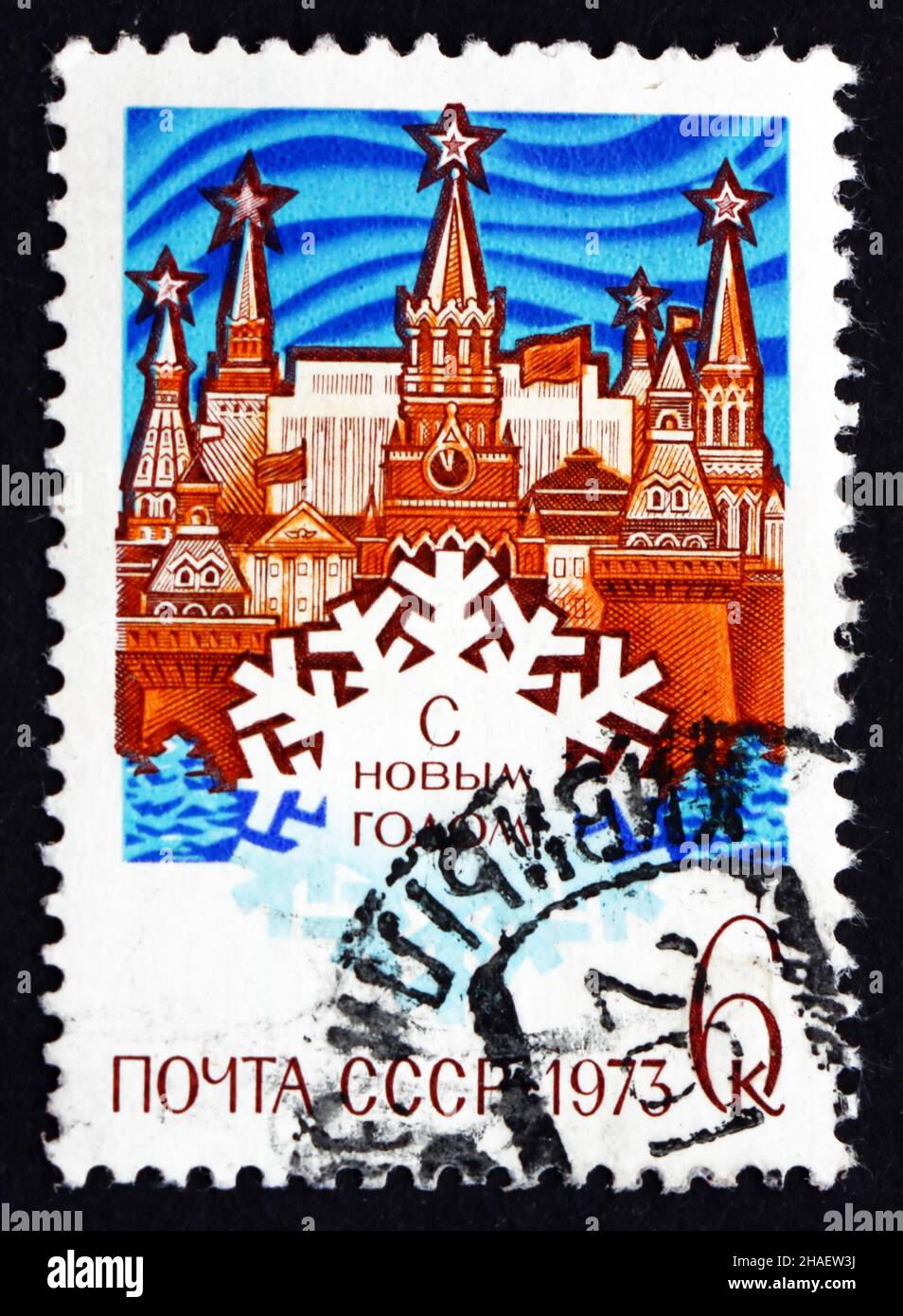 RUSSIA - CIRCA 1972: a stamp printed in the Russia shows Kremlin and Snowflake, New Year 1973, circa 1972 Stock Photo