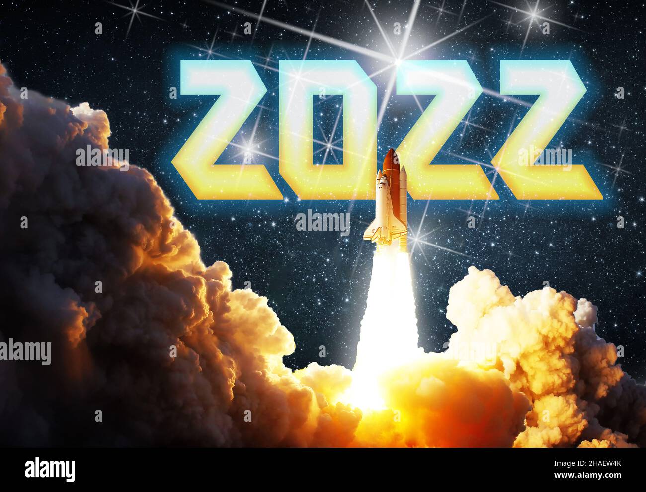 Happy New Year for an explosive and powerful 2022. Energizing starting with high motivation to be successful. Spaceship or rocket on mission to the ne Stock Photo