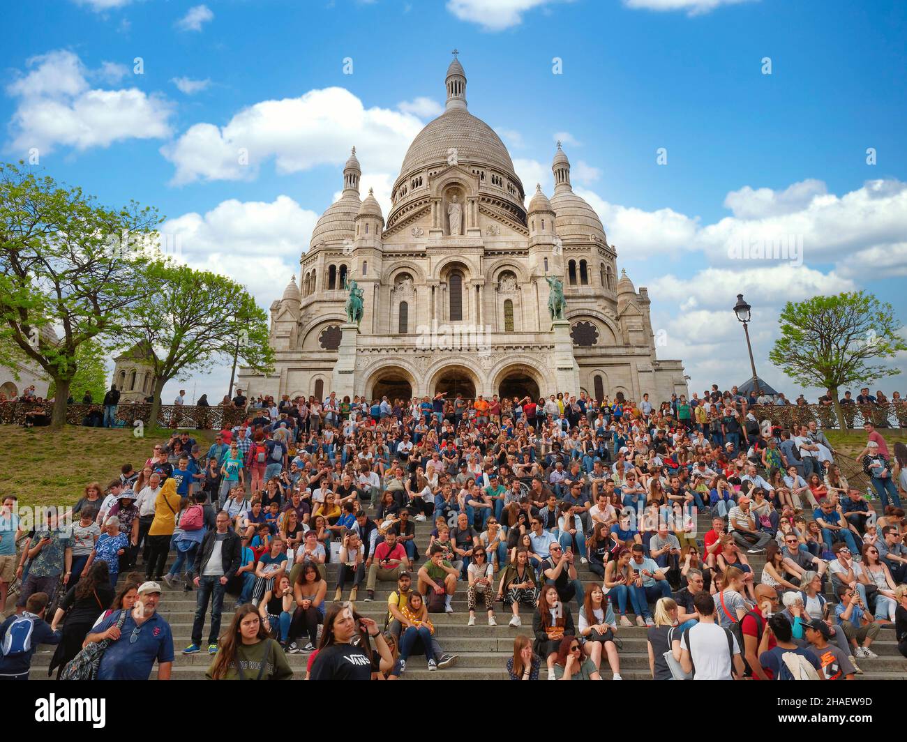 Paris, France - April 2019: Sacre Coeur Basilica Sacred Heart in Paris full of people crowded Stock Photo