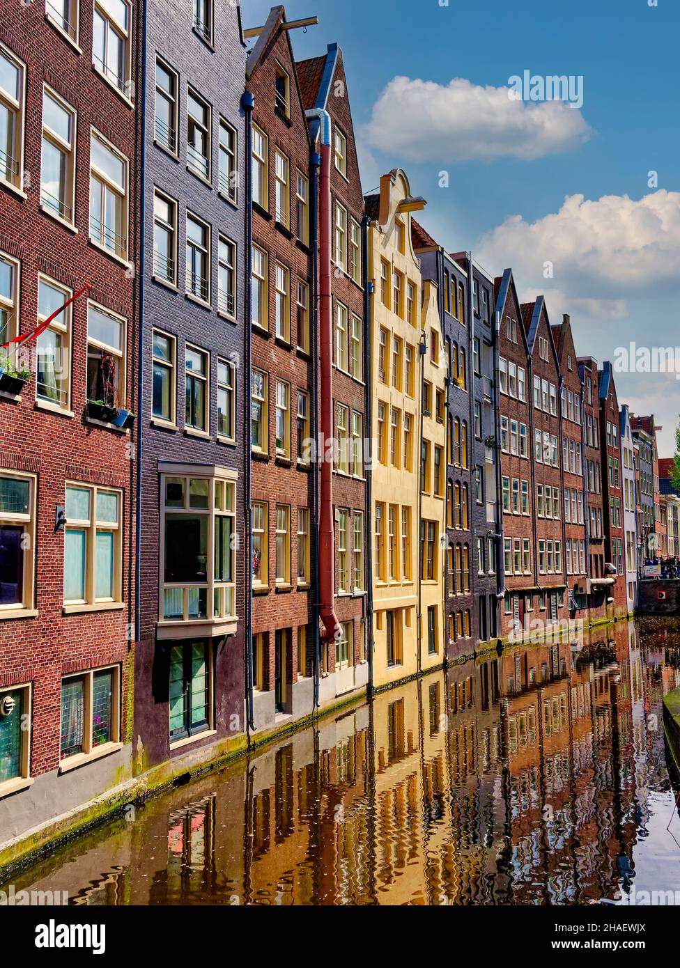 Amsterdam city, historical houses in the Old town center reflecting in canal, Holland, Netherlands Stock Photo