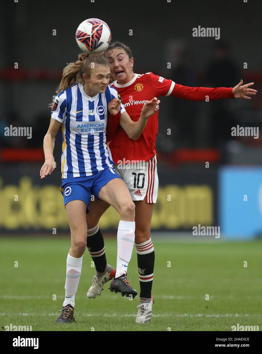 Crawley, UK, 12th December 2021. Ellie Brazil of Brighton and Hove Albion and Katie Zelem of Manchester United challenge for the ball during the The FA Women's Super League match at The People's Pension Stadium, Crawley. Picture credit should read: Paul Terry / Sportimage Credit: Sportimage/Alamy Live News Stock Photo