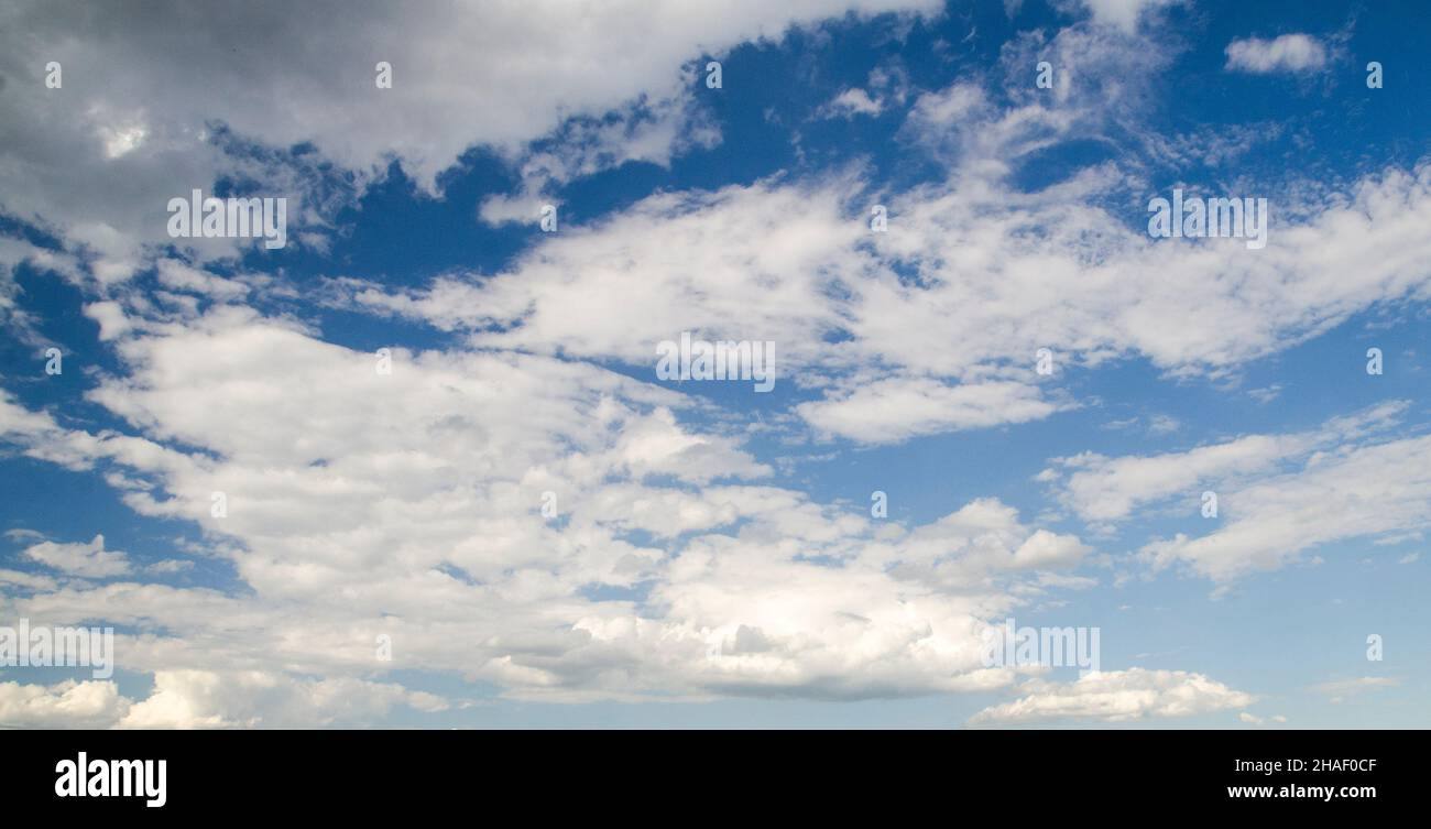 White clouds in the blue summer sky, natural background Stock Photo - Alamy