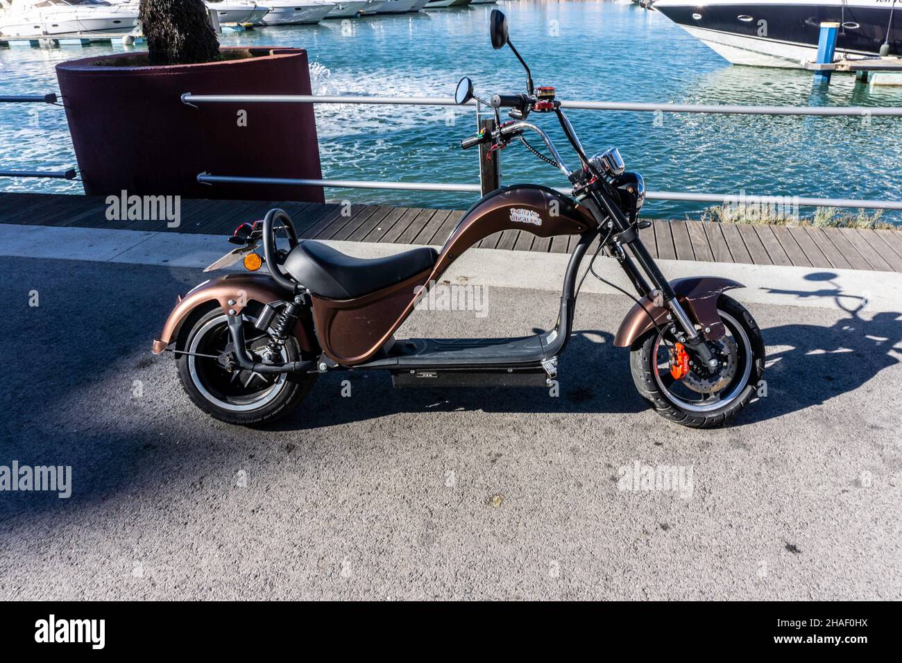 An Electric Harley chopper Citycoco Electric Scooter parked in the harbour area of Vilamoura, Portugal. , vilamoura, portugal, chopper, harley, Stock Photo