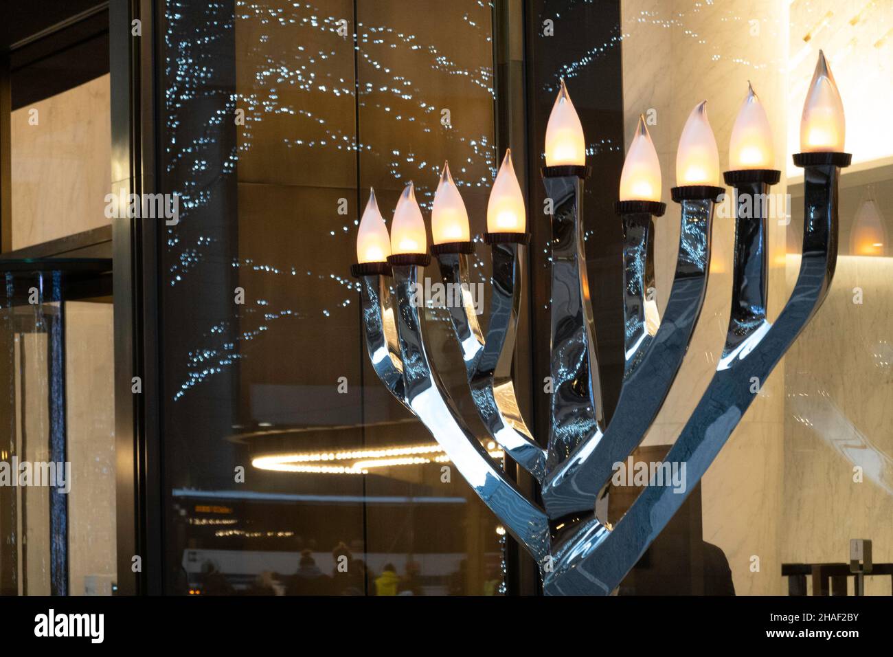 Hanukkah menorah is brightly lit in the One Vanderbilt pedestrian plaza