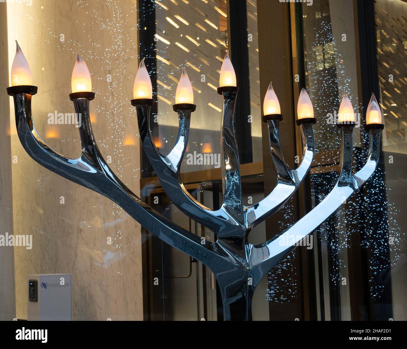 Hanukkah menorah is brightly lit in the One Vanderbilt pedestrian plaza