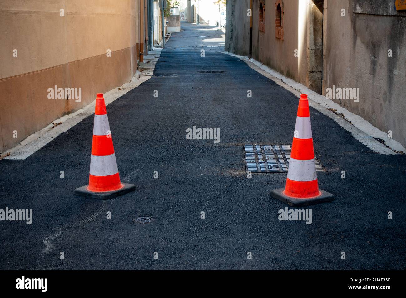 warning road cones marking blocked off road Stock Photo