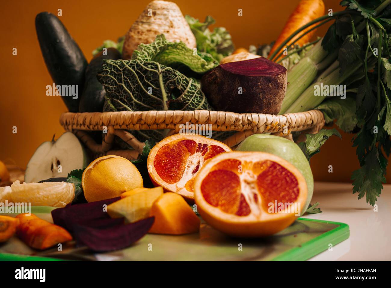 wooden basket of healthy food fruits and vegetables Stock Photo