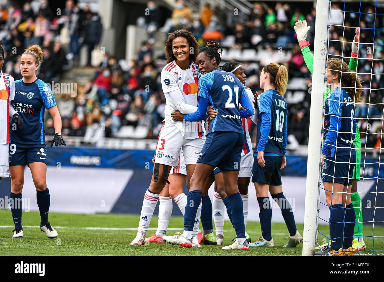 Paris, France. 12th Dec, 2021. Wendie Renard of Olympique Lyonnais and Ouleymata Sarr of Paris FC during the Women's French championship, D1 Arkema football match between Paris FC and Olympique Lyonnais (OL) on December 12, 2021 at Charlety Stadium in Paris, France. Photo by Victor Joly/ABACAPRESS.COM Credit: Victor Joly/Alamy Live News Stock Photo