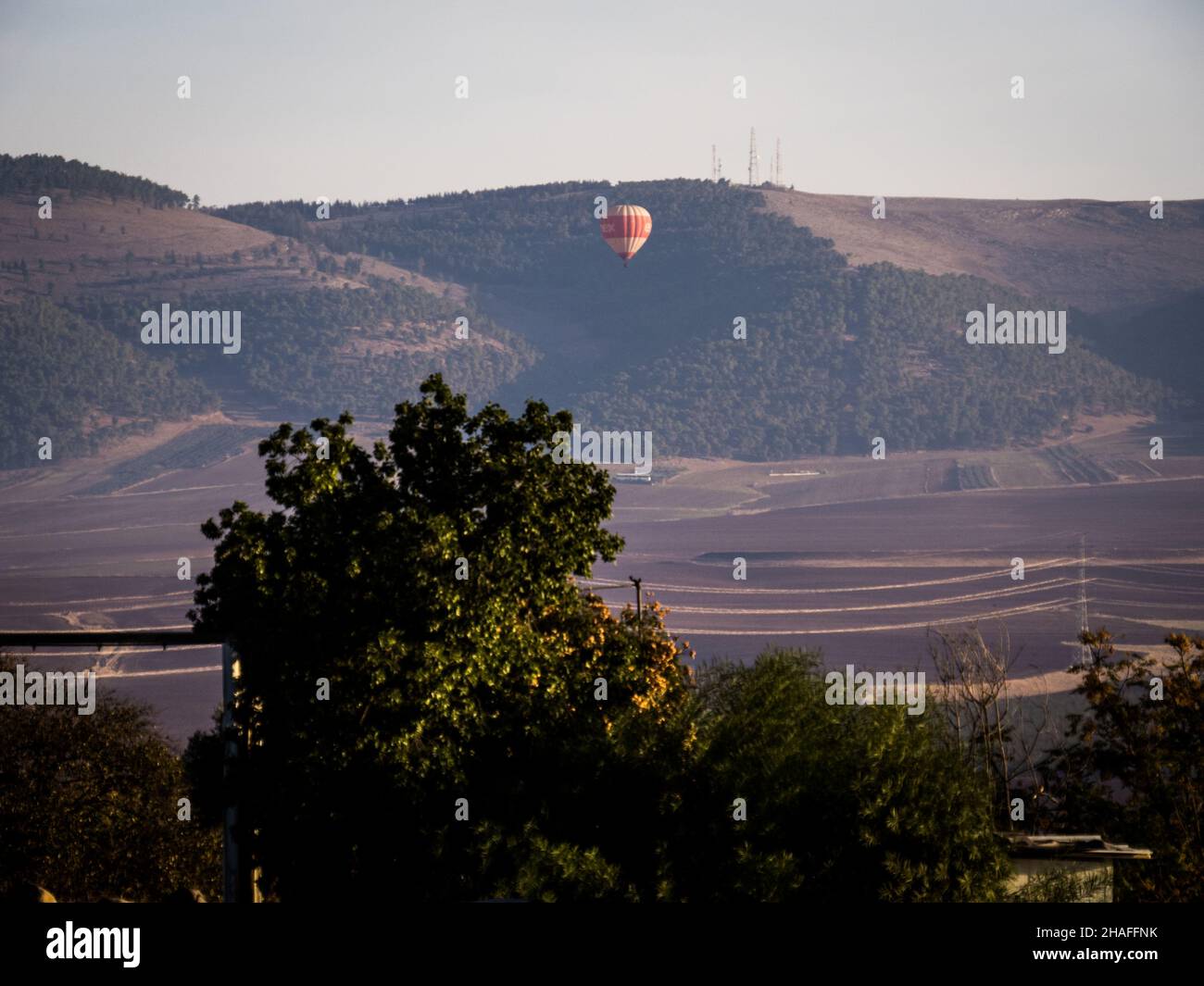 Hot air balloon passes through the Jezreel Valley, Israel Stock Photo