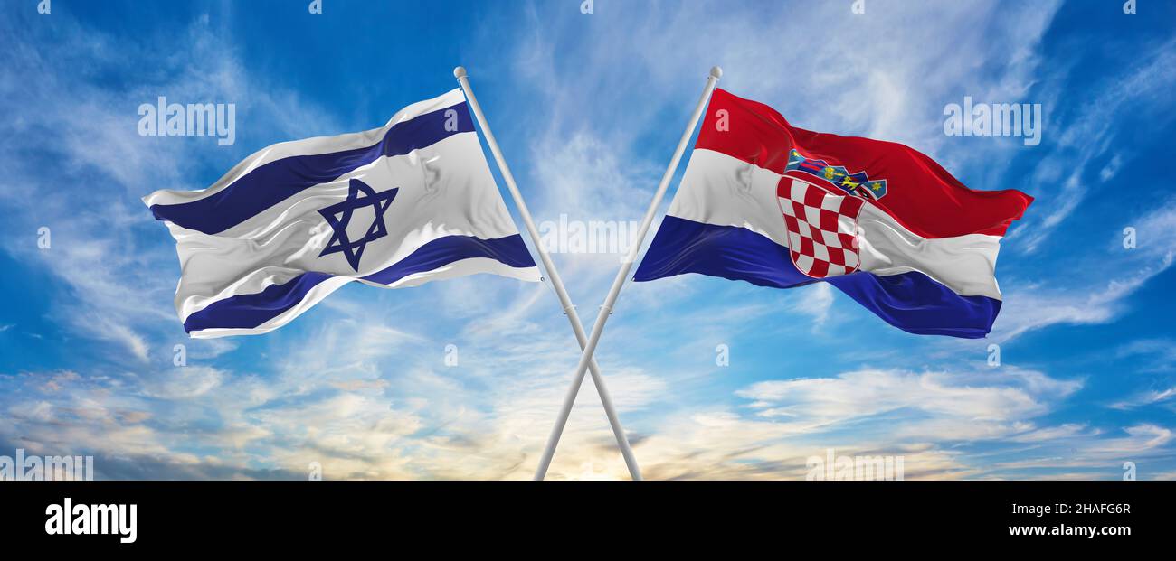 crossed national flags of Israel and Croatia flag waving in the wind at ...