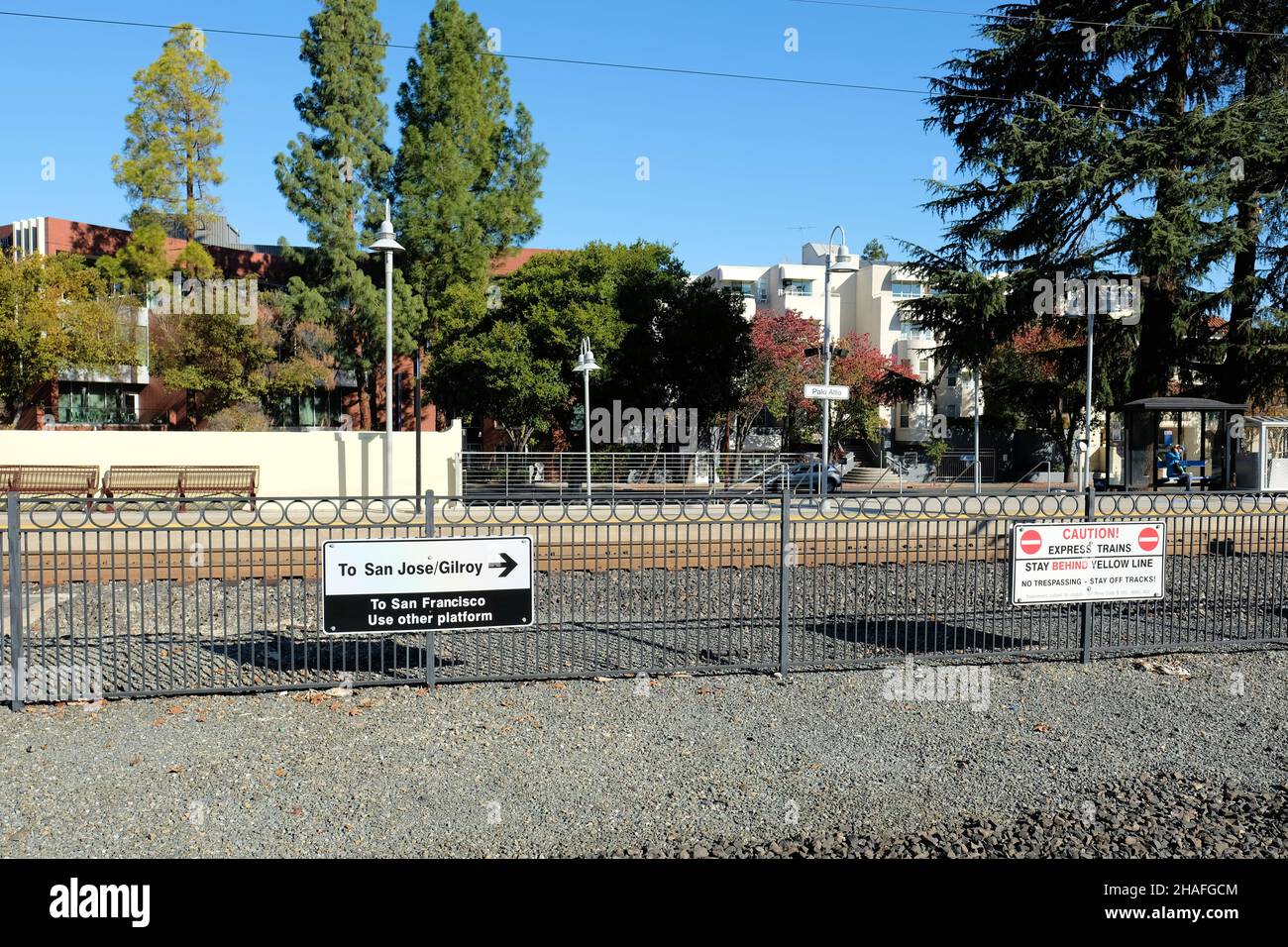 Sign at the Palo Alto Transit Center railroad tracks pointing towards San Jose, Gilroy, and San Francisco for commuters boarding trains. Stock Photo