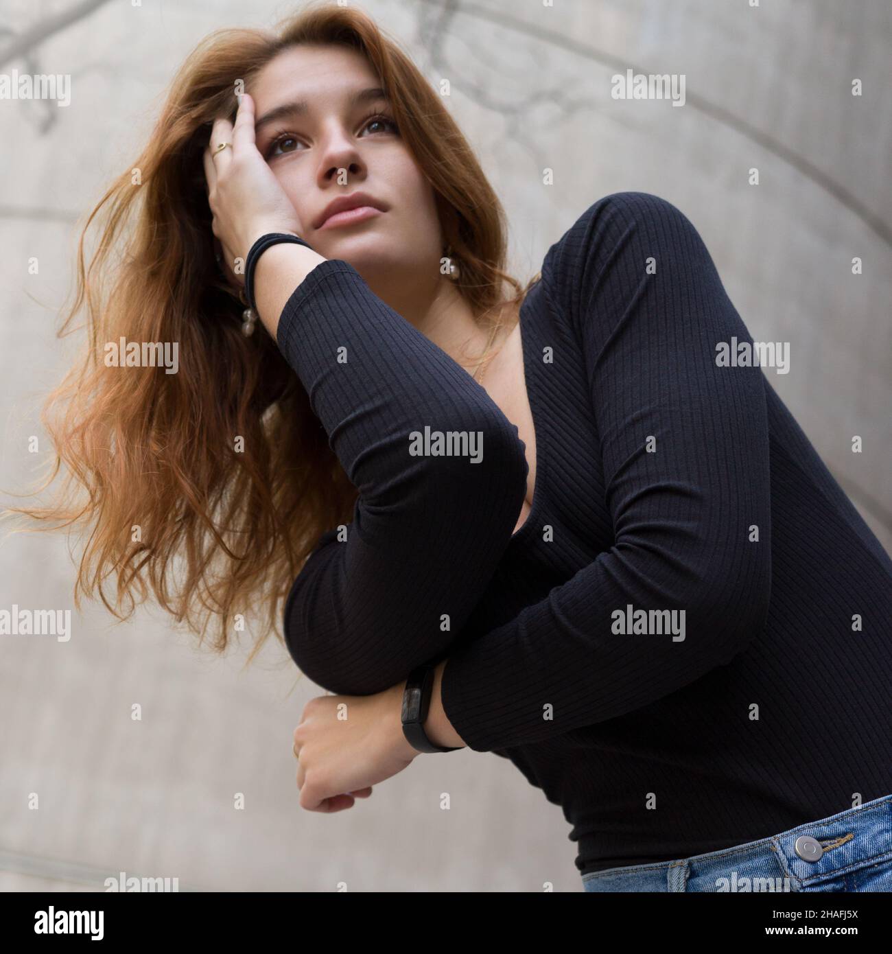 Portrait of a young woman with long red hair Stock Photo - Alamy