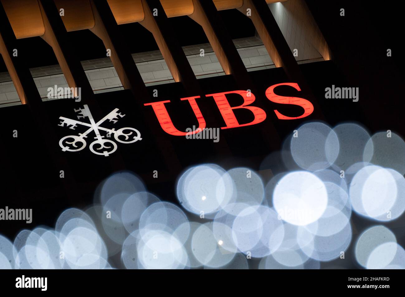 10 December 2021, Hessen, Frankfurt/Main: The UBS Group AG logo on the bank's headquarters in downtown Frankfurt. A Paris appeals court has reopened the accusations of tax fraud against the major Swiss bank UBS. As in the first instance, the bank faces a fine in the billions in the appeal process. Photo: Sebastian Gollnow/dpa Stock Photo