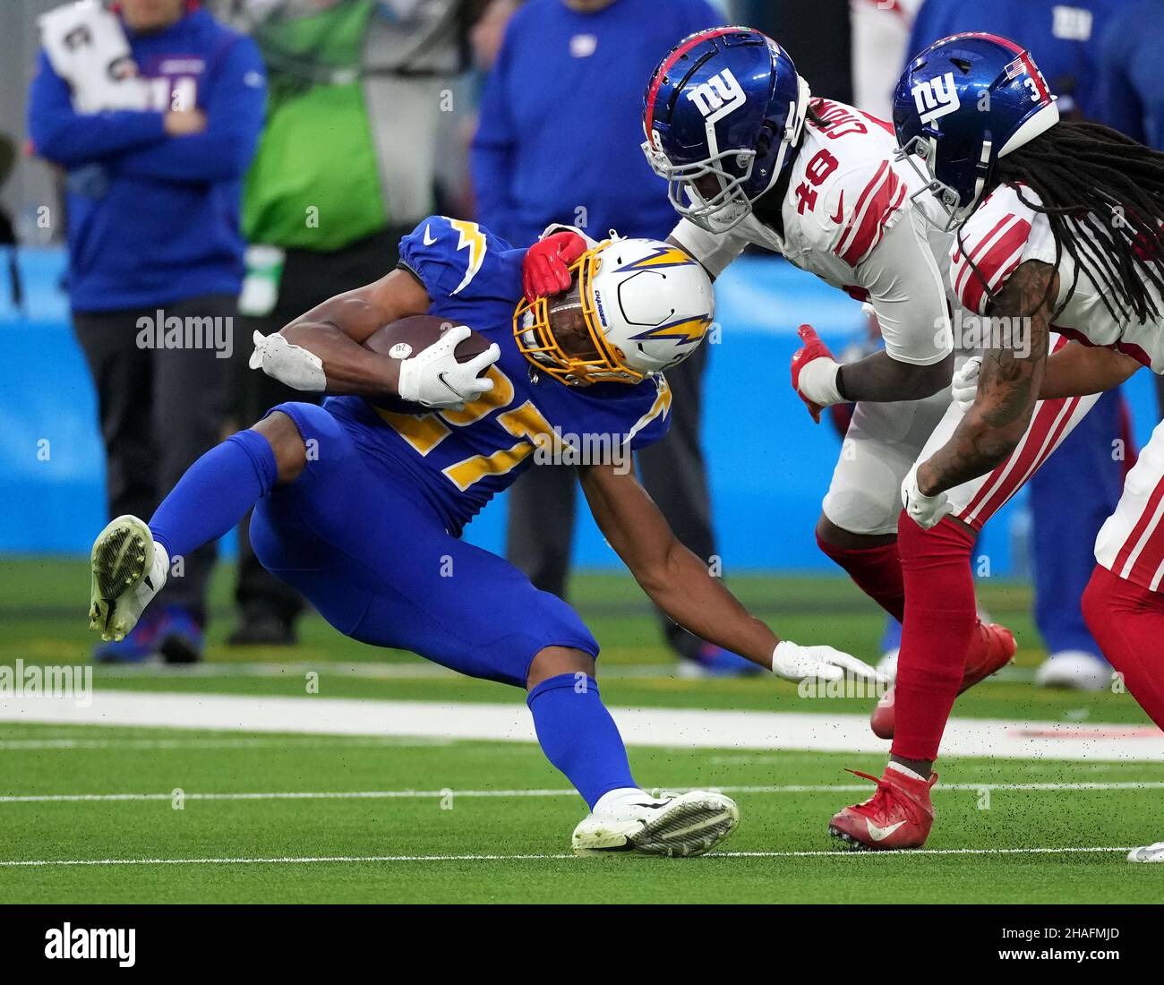 Los Angeles Chargers running back Josh Kelley (27) is tackled by New York Giants linebacker Tae Crowder (48) during third quarter action at SoFi Stadium on Sunday, December 12, 2021 in Inglewood, California. The Chargers defeated the Giants 37-21. Photo by Jon SooHoo/UPI Stock Photo