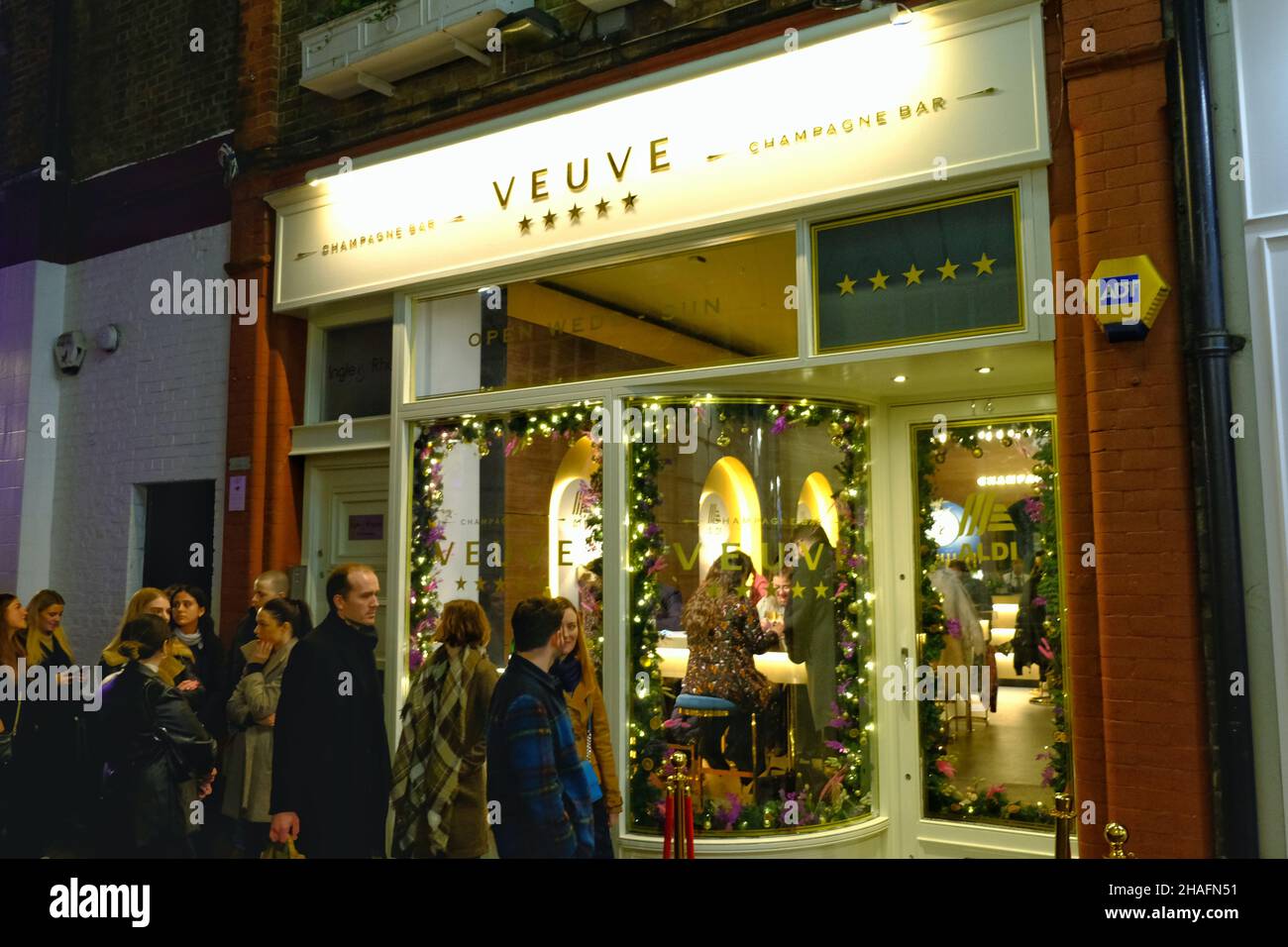London, UK, 12th Dec, 2021. German supermarket chain Aldi opened a pop-up  champagne bar selling their own award-winning Veuve Monsigny champagne. At  only £2.33 a glass, Aldi claims it is the cheapest