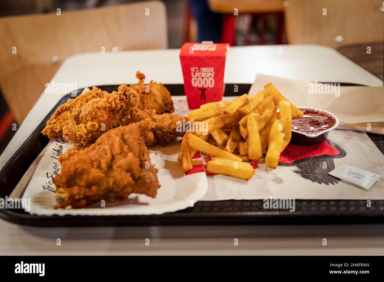 London, England - October 13 2021: KFC Mighty Bucket for One meal with additional chicken popcorn Stock Photo