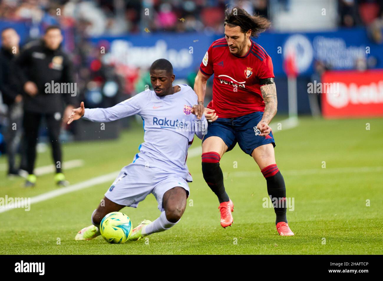 Pamplona, Spain. 12th Dec, 2021. Ousmane Dembelé (L), forward of FC Barcelona, and Juan Cruz (R), defender of CA Osasuna are seen in action during the Spanish football of La Liga Santander, the match between CA Osasuna and FC Barcelona at the Sadar stadium in Pamplona.(Final score; CA Osasuna 2:2 FC Barcelona) Credit: SOPA Images Limited/Alamy Live News Stock Photo
