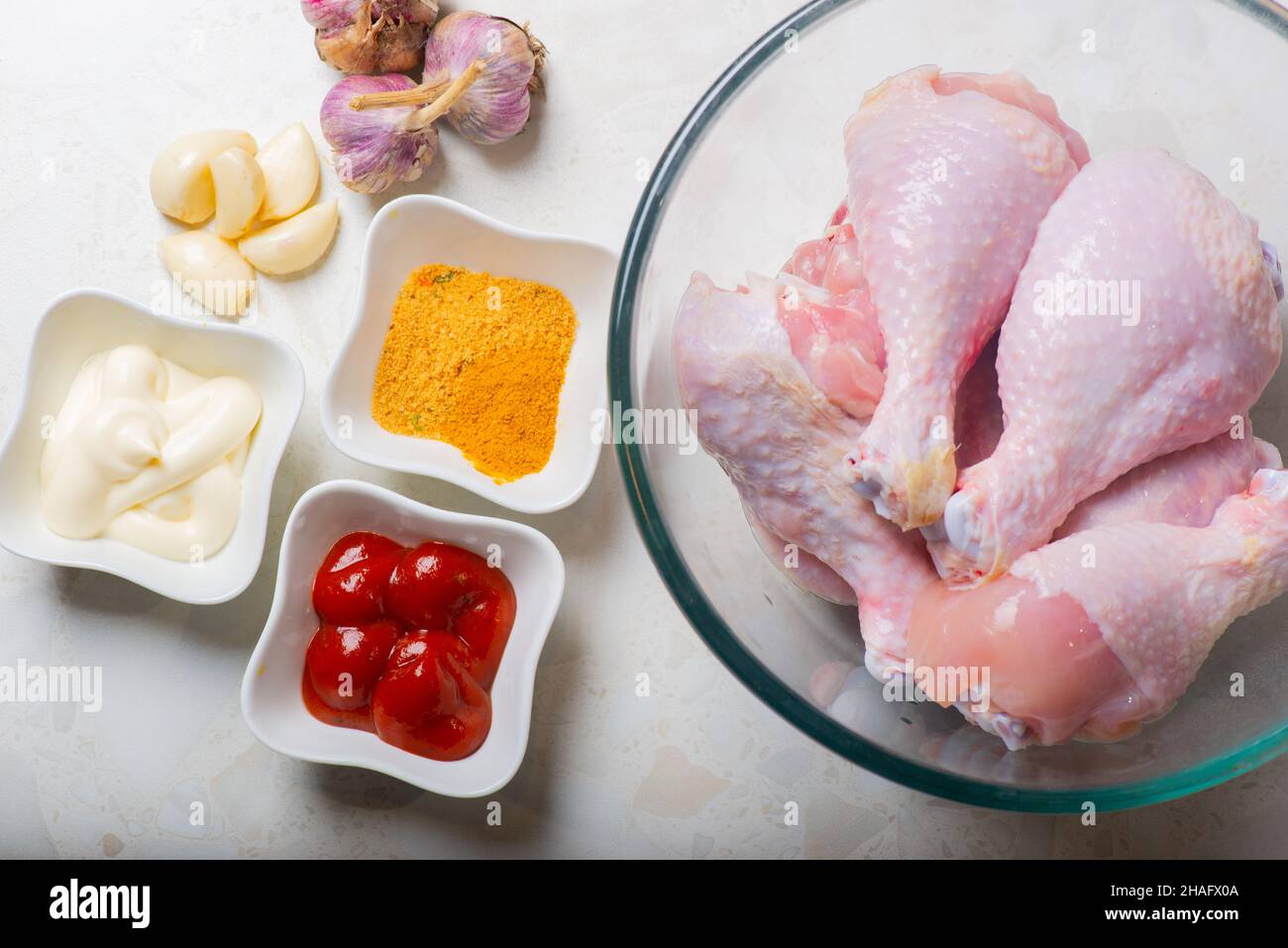 garlic and seasonings for marinating chicken drumsticks Stock Photo Alamy