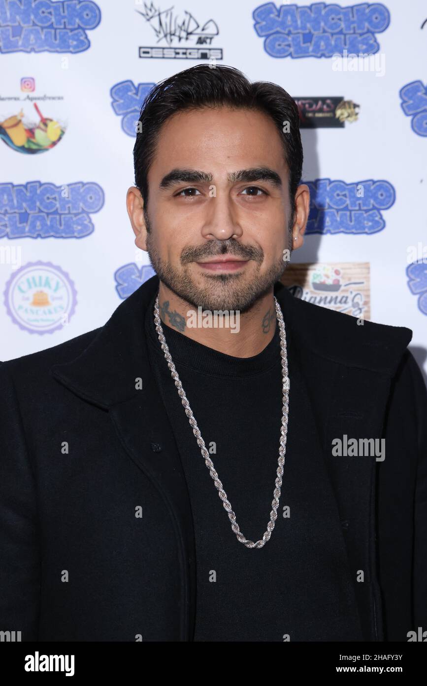 Los Angeles, California, USA. 10th December, 2021. Actor Anthony L. Fernandez attending Michael Flores 'Sancho Claus' Blue Carpet Event to celebrate the re-release of the movie at the Metroplis Roof Top in Los Angeles, California. Credit: Sheri Determan Stock Photo