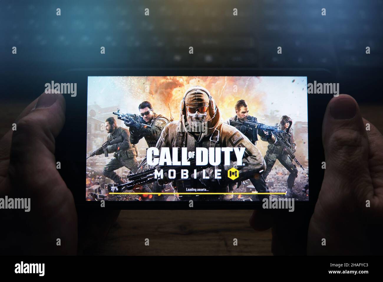 Kostanay, Kazakhstan, November 05, 2021Man holds a mobile phone with a screensaver of the popular Call of Duty game Stock Photo