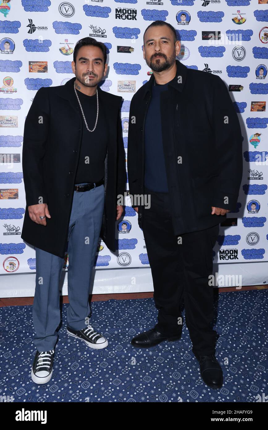 Los Angeles, California, USA. 10th December, 2021. Actors Anthony Fernandez and Michael Anthony Perez attending Michael Flores 'Sancho Claus' Blue Carpet Event to celebrate the re-release of the movie at the Metroplis Roof Top in Los Angeles, California. Credit: Sheri Determan Stock Photo