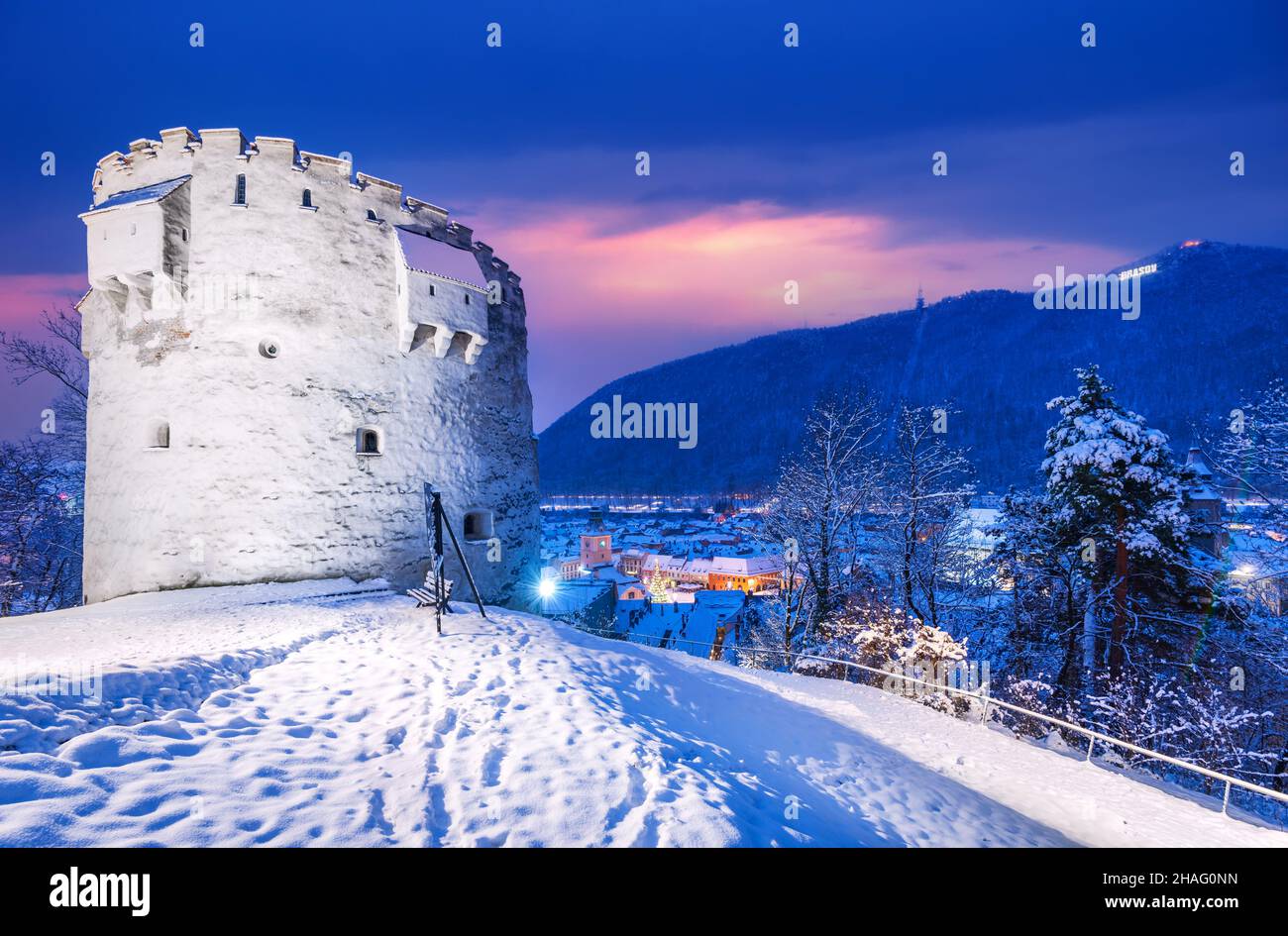 Brasov, Romania - The White Tower, winter snowy landscape with ruins of medieval Corona fortifications, Transylvania. Stock Photo