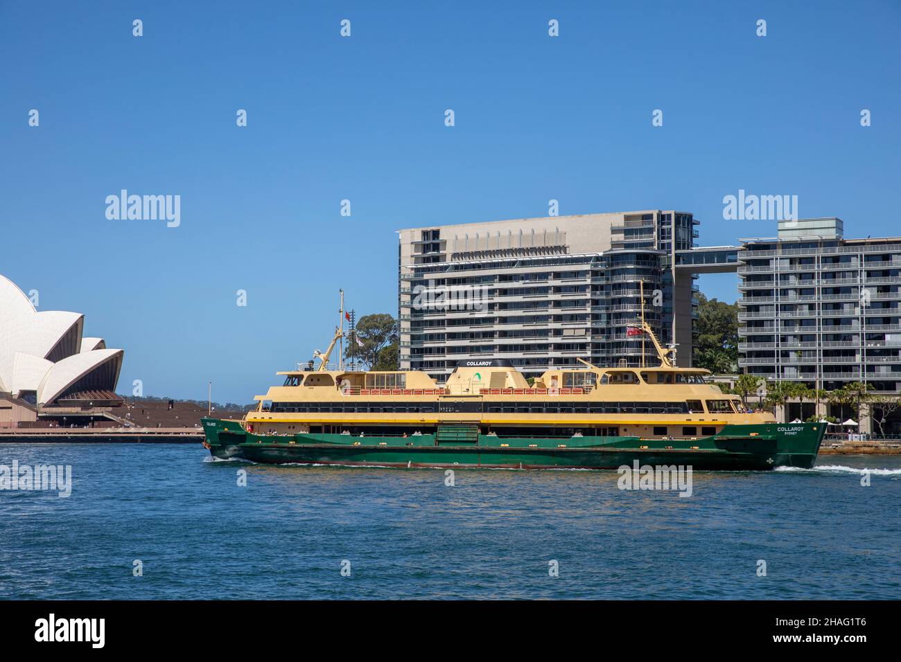 Freshwater class ferry the MV Collaroy passes bennelong point apartment buildings at east circular quay as she approaches circular quay terminus Sydne Stock Photo