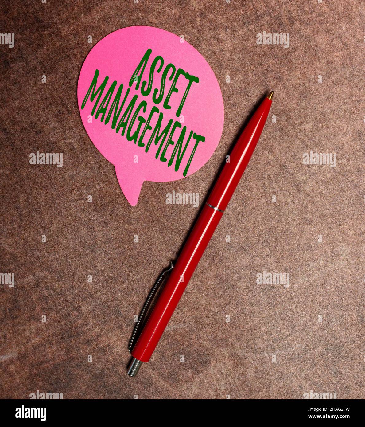 Hand writing sign Asset Management. Concept meaning systematic process