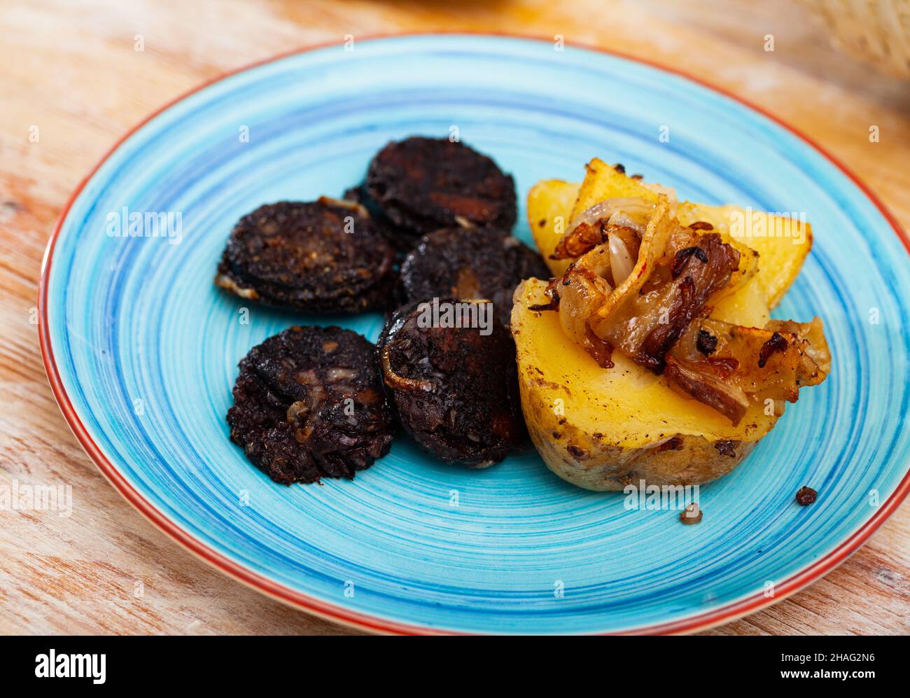 La Rellena Spanish blood sausage morcilla served with potato and onion Stock Photo ...