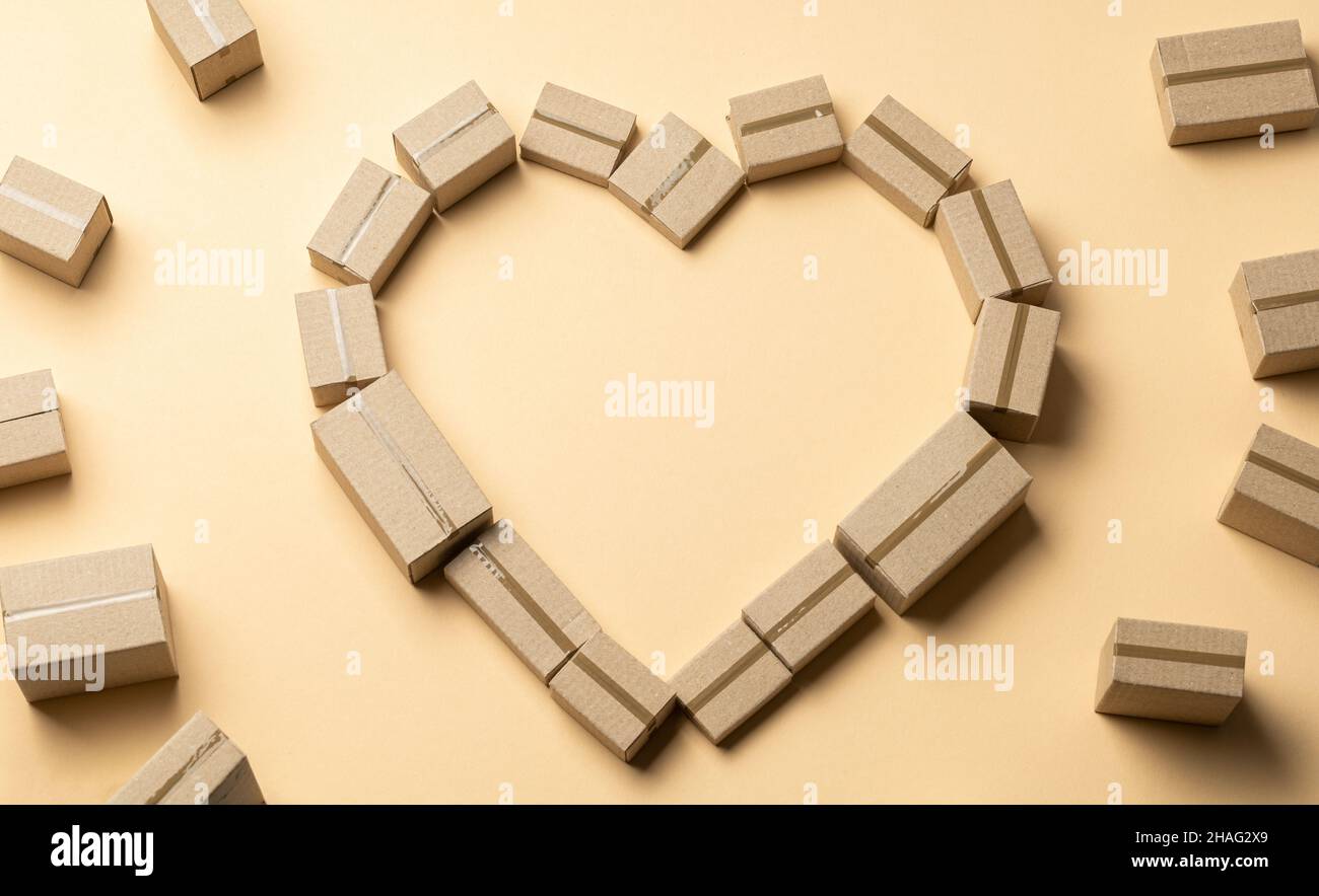 Heart symbol made from cardboard boxes on a brown background. Favorite ...