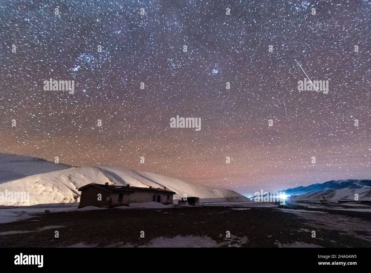 BAZHOU, CHINA - DECEMBER 12, 2021 - A Geminid meteor shower streaks ...