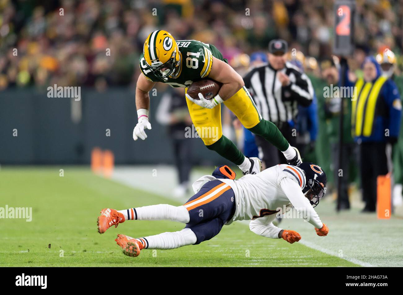 Green Bay, Wisconsin, USA. 12th Dec, 2021. Green Bay Packers tight end Josiah  Deguara #81 catches the ball over Chicago Bears free safety Eddie Jackson  #4 during NFL football game between the