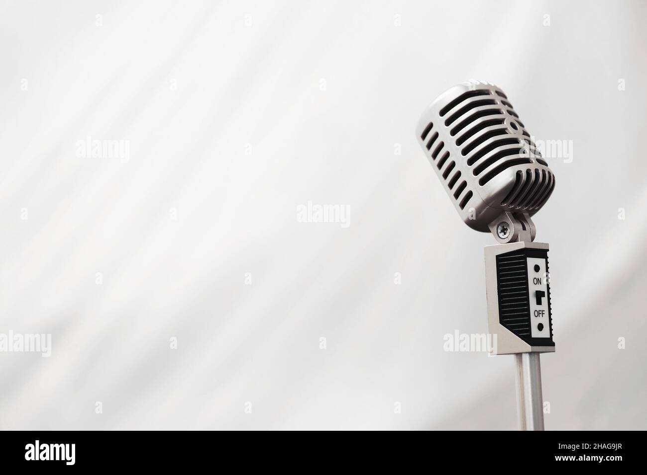 Stand with a retro microphone. Microphone on a tripod. Performance of